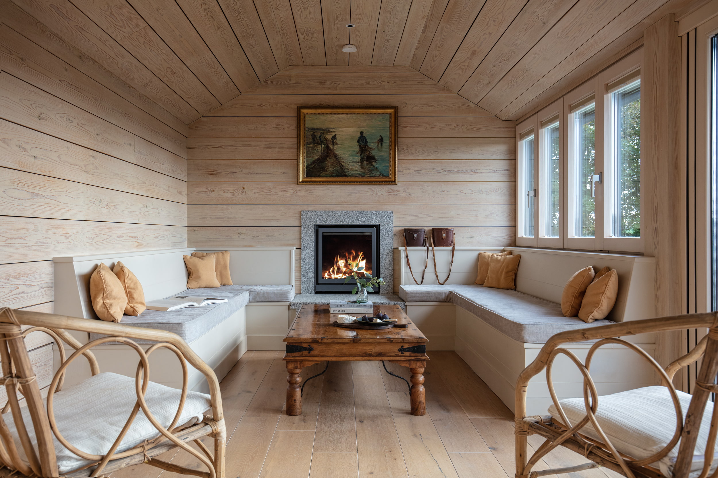 A wooden living room with beige walls and ceiling.