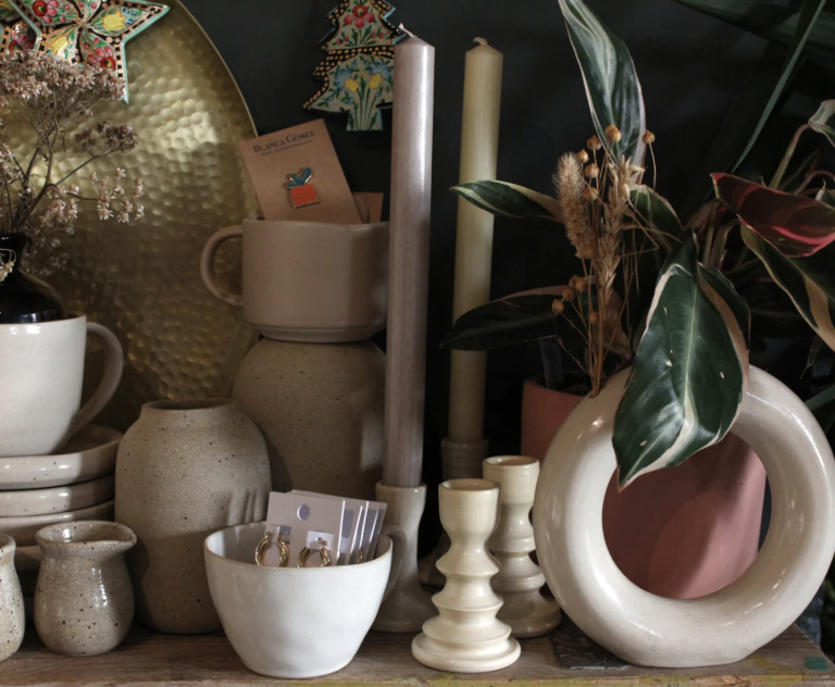 An arrangement of beige ceramic pots and bowls