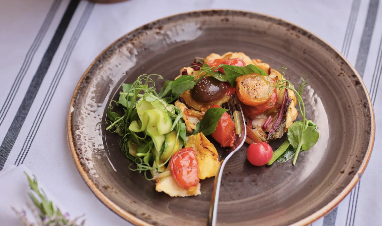 A plated dish featuring assorted roasted vegetables